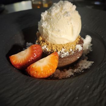 ABSteak by Chef Akira Back - Chocolate lava cake (fondant chocolat) topped with ice cream and white chocolate dust - Steakhouses Near Me - Los Angeles, California ABSteak by Chef Akira Back - Chocolate lava cake (fondant chocolat) topped with ice cream and white chocolate dust - Steakhouses Near Me - Los Angeles, California