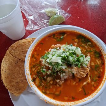 Tacos Los Guero - My small pork posole. It comes with hominy. I added onion, cilantro, and lime - Mexican Near Me - Norwalk, California Tacos Los Guero - My small pork posole. It comes with hominy. I added onion, cilantro, and lime - Mexican Near Me - Norwalk, California