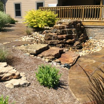 Penn Landscaping - a garden with a waterfall - Landscaping Near Me - Bloomington, Illinois Penn Landscaping - a garden with a waterfall - Landscaping Near Me - Bloomington, Illinois