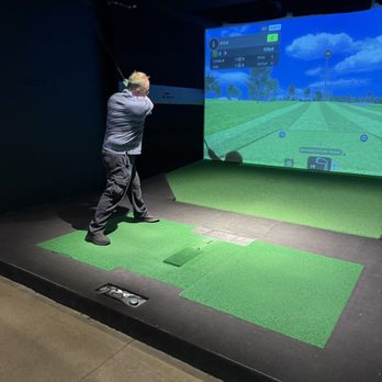 X-Golf Columbus - Swinging the golf club - Golf Near Me - Grandview Heights, Ohio