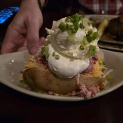Malcuit's Tavern - Super loaded baked potato....so  yummy