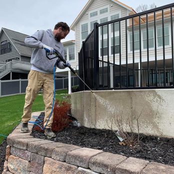 The Michigan Painter - Pressure Washing concrete retaining wall in preparation for solid color staining. - Painters Near Me The Michigan Painter - Pressure Washing concrete retaining wall in preparation for solid color staining. - Painters Near Me