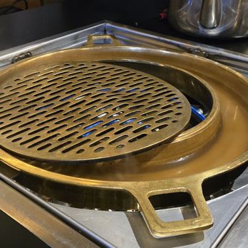 Boon Dee Moo Ka Ta - Putting the grill on - Thai Near Me - Flushing, New York