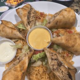 Chicken tacos over a bed of rice