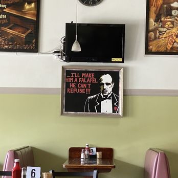 Wafaa N Mike Cafe - a tv above the table - Mediterranean Near Me - Jacksonville, Florida Wafaa N Mike Cafe - a tv above the table - Mediterranean Near Me - Jacksonville, Florida