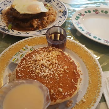 808 Grindz Cafe - Macadamia nut pancakes and the mac sauce in the front. 808 grindz moco in the back substituted with fried rice instead of white rice. - Cafes Near Me - Lahaina, Hawaii