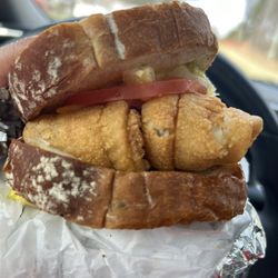 Sea Hut - Flounder sandwich on wheat bread with lettuce, tomatoes and mustard.