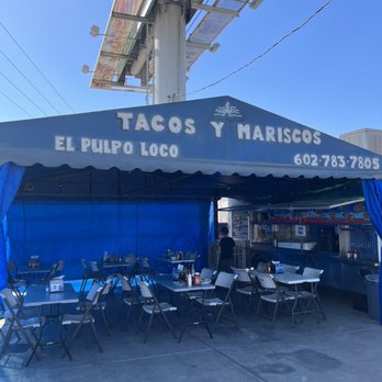El Pulpo Loco - a blue tent with tables and chairs - Food Trucks Near Me - Phoenix, Arizona El Pulpo Loco - a blue tent with tables and chairs - Food Trucks Near Me - Phoenix, Arizona