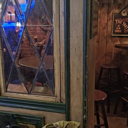 McKibbin's Irish Pub - It's all here:  a woodsy look, diamond pane glass, and reference to Guinness ("the Taste of Ireland") on that other wall.