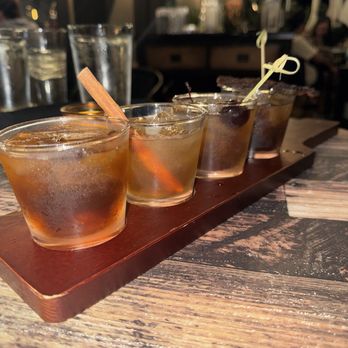 Whiskey 'N Rye Smokehouse - Whiskey flight, espresso old fashioned, apple pie old fashioned, peach old fashioned, and maple bacon old fashioned. - Barbeque Near Me - Solvang, California
