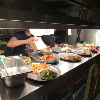 Nando's - A busy kitchen - Chicken Shop Near Me - Soho, XGL
