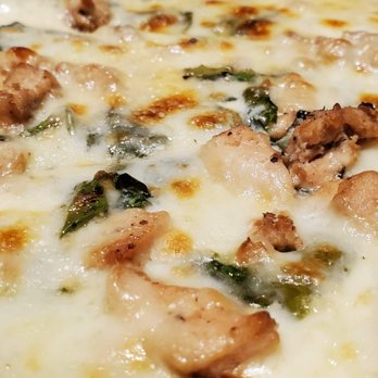 Schiano's Pizza - a close up of a pizza - Pizza Near Me - Richardson, Texas