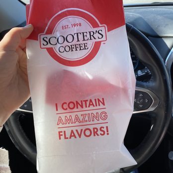 Scooter's Coffee - a person holding a bag of coffee - Coffee & Tea Near Me - Omaha, Nebraska Scooter's Coffee - a person holding a bag of coffee - Coffee & Tea Near Me - Omaha, Nebraska