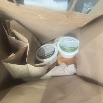 Panera Bread - Bagels in a regular paper bag with cream cheese and napkins sitting on top. - Sandwiches Near Me - Hanford, California