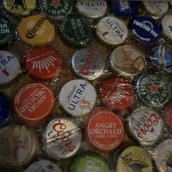 Bayport Inn - Beer cap collection under acrylic at the bar.