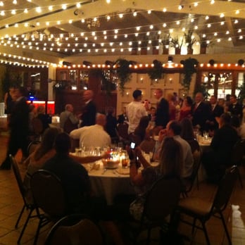 El Adobe - Inside the reception room before the roof opened. LOVE the bistro lights - I didn't love the brown chairs/floor. - Latin American Near Me - San Juan Capistrano, California