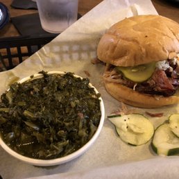 BBQ pork sandwich with pickles and coleslaw BBQ pork sandwich with pickles and coleslaw