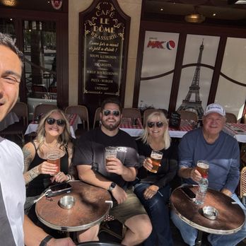 Le Diplomate - Our waiter making sure our beers did not go empty and provided a great deal of entertainment, He was a nice guy. - Bars Near Me - Paris, 75