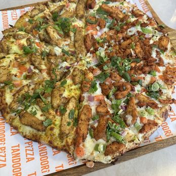Tandoori Pizza - Half butter chicken (left) and half tandoori chicken (right) large pizza - Indian Near Me - Sunnyvale, California Tandoori Pizza - Half butter chicken (left) and half tandoori chicken (right) large pizza - Indian Near Me - Sunnyvale, California