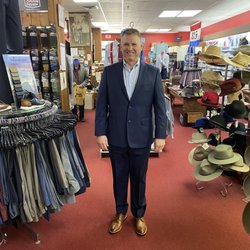 Miller Bros-Newton - Suit fitting and alterations in an empty store.