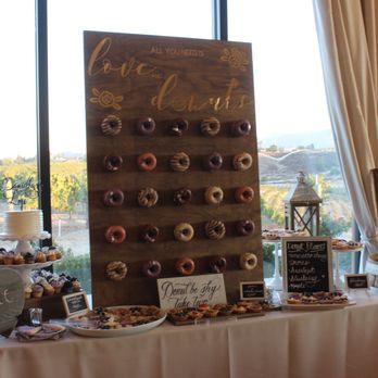 Sweet Cheats Cakes - a display of doughnuts - Desserts Near Me Sweet Cheats Cakes - a display of doughnuts - Desserts Near Me