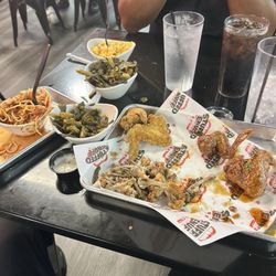 $1.00 wing night aftermath with a side of spaghetti and greens Couldn't eat it all. Big portions!! Always flavored so well.