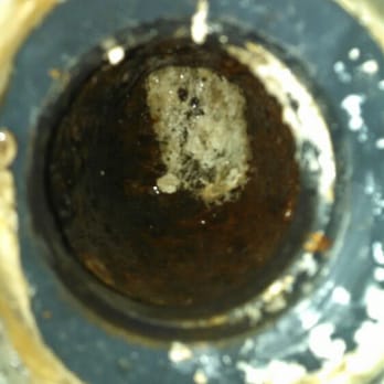 Universal Drain - Removing calcium from pipe - Plumbing Near Me