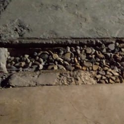 The Island - Some holes filled with pebbles, instead of properly being fixed.