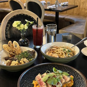 Gordon Tavern - plates of food on a table - New American Near Me - Eugene, Oregon
