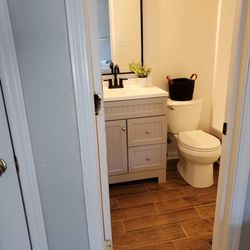 Great Under Pressure - The finish of the small bathroom that was our very first job. We are licensed bonded and insured