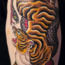 Miami Ink - Love Hate Tattoos - My tiger and snake tattoo by Ami James.
