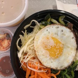 a bowl of food and a cup of coffee