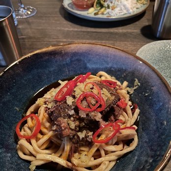Reckless Noodle House - Ma La Braised Beef Cheek Noodle & Wok-Seared Turmeric Rock Fish - Bars Near Me - Seattle, Washington Reckless Noodle House - Ma La Braised Beef Cheek Noodle & Wok-Seared Turmeric Rock Fish - Bars Near Me - Seattle, Washington