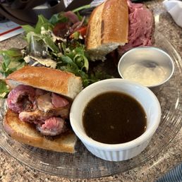 Prime roast French dip sandwich with tossed salad Prime roast French dip sandwich with tossed salad