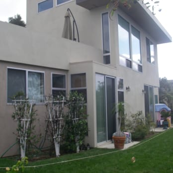 Tm Construction - a house with a garden in the foreground - General Contractors Near Me - El Cajon, California Tm Construction - a house with a garden in the foreground - General Contractors Near Me - El Cajon, California