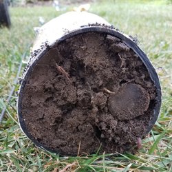 Advanced Sprinkler & Drainage Repair - Fully impacted landscape drain line.