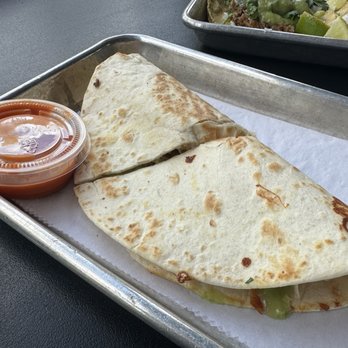 Hunger Street Tacos - CHICKEN QUESADILLAS - Shredded Chicken, Chihuahua Cheese, Avocado Salsa Verde - Tacos Near Me - Winter Park, Florida Hunger Street Tacos - CHICKEN QUESADILLAS - Shredded Chicken, Chihuahua Cheese, Avocado Salsa Verde - Tacos Near Me - Winter Park, Florida