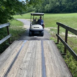 Cedar Trace Golf Club - Golf cart near bridge