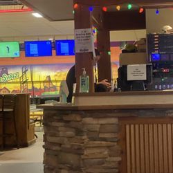 Rock House Hardwood Grille - Employee sitting on the counter.