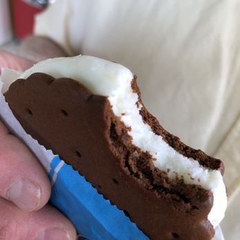 Walker Bros Ice Cream - a person holding a chocolate ice cream sandwich - Ice Cream & Frozen Yogurt Near Me - Montgomery, Ohio Walker Bros Ice Cream - a person holding a chocolate ice cream sandwich - Ice Cream & Frozen Yogurt Near Me - Montgomery, Ohio