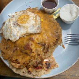 High on the Hog Cakes, added fried eggs for $4.00 for 2, ate the other one before I took the picture
