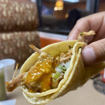 Franky's Tacos - a hand holding a chicken taco - Mexican Near Me - South Bend, Indiana Franky's Tacos - a hand holding a chicken taco - Mexican Near Me - South Bend, Indiana