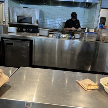 CAVA - View into kitchen - Salad Near Me - Westlake Hills, Texas