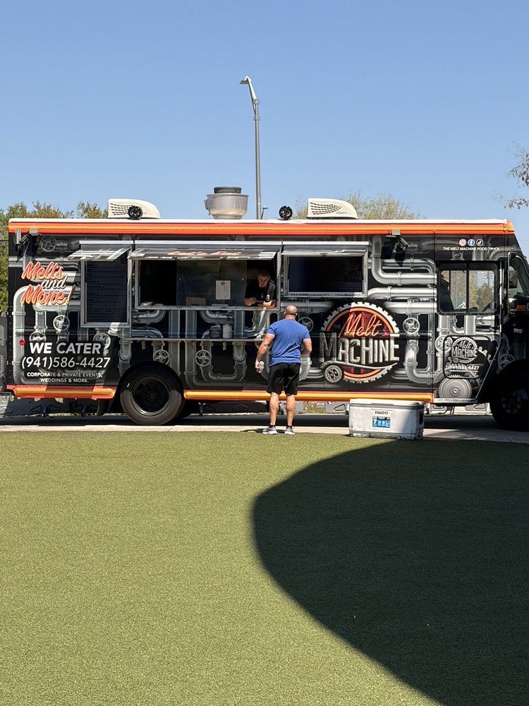 The Melt Machine Gourmet Grilled Cheese Logo