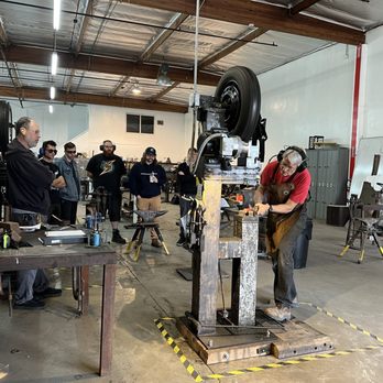 Adam's Forge - Instructor Gary teaching power hammer safety to make a railroad spike knife. - Art Classes Near Me - Simi Valley, California