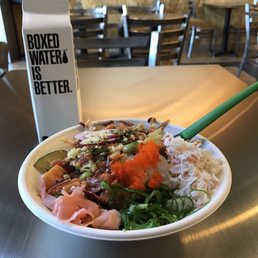 Small poke bowl-  generous protein and toppings!  They also sell boxed water here.  Very cool.