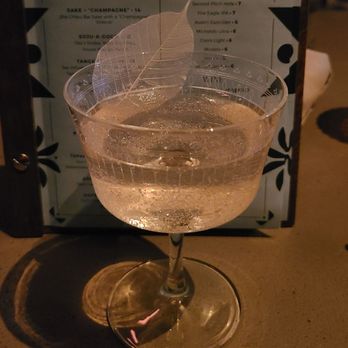Anaqua Garden Bar - a glass of wine with a leaf on it - Bars Near Me - San Antonio, Texas