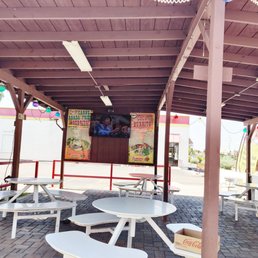 a patio with tables and chairs a patio with tables and chairs