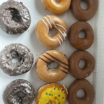 Krispy Kreme - The 4 on the right  No clue what they are Didn't order them no one ate them!  Try to call you get a full mailbox! - Donuts Near Me - East Rutherford, New Jersey