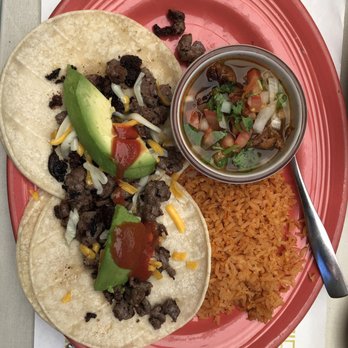 Carlos Restaurante - Two tacos with carne asada, pinto beans, and rice. - Mexican Near Me - Cave Junction, Oregon Carlos Restaurante - Two tacos with carne asada, pinto beans, and rice. - Mexican Near Me - Cave Junction, Oregon